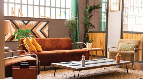 Beautiful living room in bright industrial loft. Indoors decorat