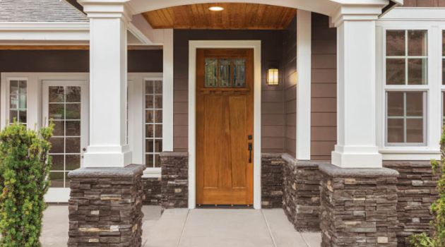 New Luxury Home Exterior Detail: New House Front Door and Covere